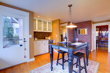 Luxury white kitchen with beautiful stove, breakfast table