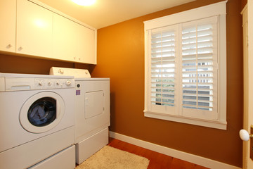 Laundry room with gold colors