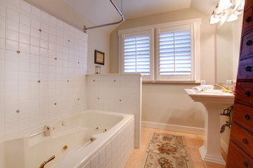 Fototapeta na wymiar Luxury antique bathroom with white tub and tiles