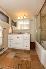 Luxury classic basement bathroom with white and beige