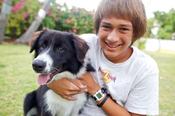 Teenage Boy with his dog, Border Collie