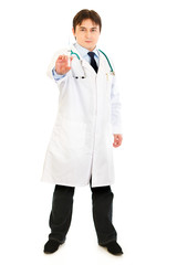 Concentrated medical doctor holding medical syringe in hand