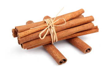 Bunch of cinnamon sticks isolated on white