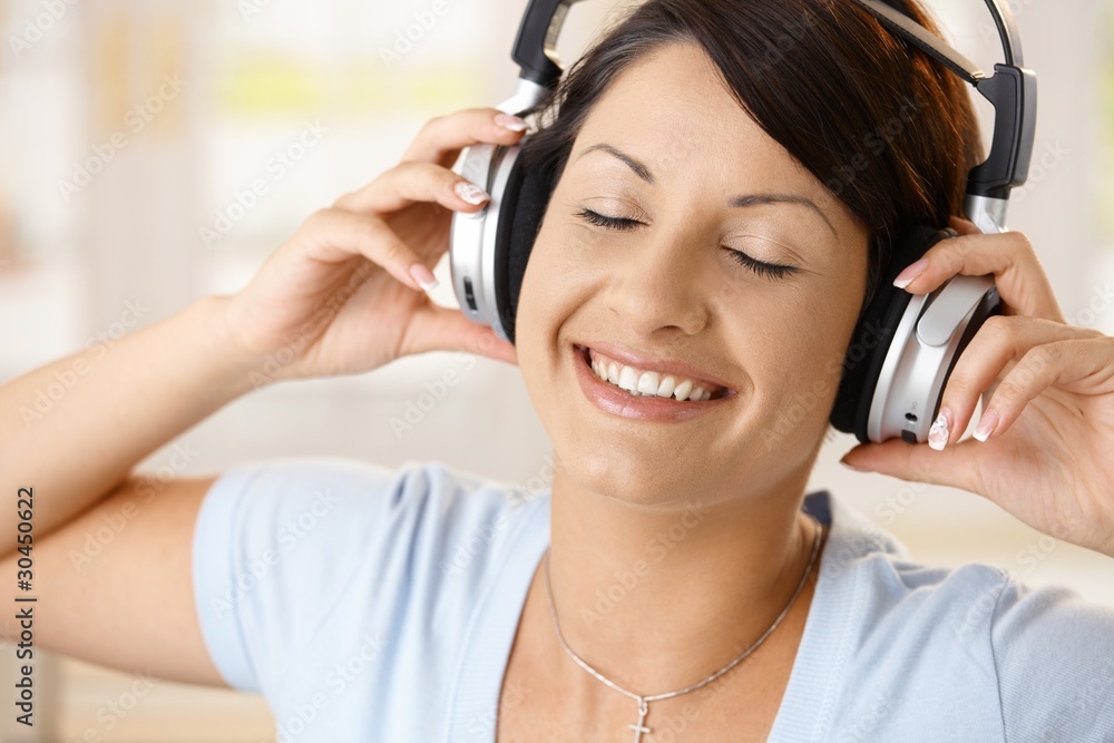 Canvas Prints Happy woman enjoying music on headphones