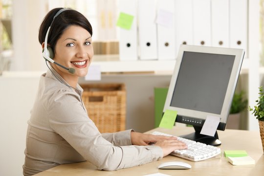 Assistant talking on headset
