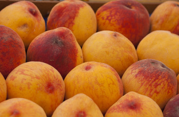 Fototapeta na wymiar Ripe peaches at a market place