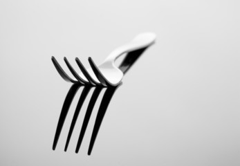 Abstract image for kitchen. Fork with reflection.