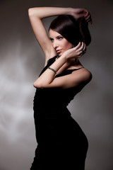 Fototapeta premium woman in black dress posing