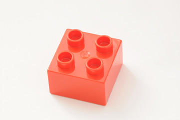 Detail shot of a red plastic brick