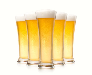 Glasses of beer isolated over white