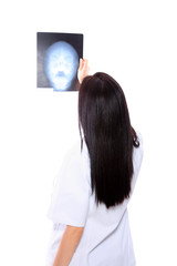 Female doctor looking at an x-ray
