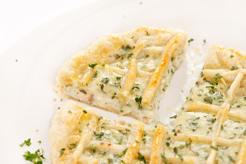 tasty quiche with cheese and herbs
