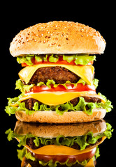Tasty and appetizing hamburger on a dark