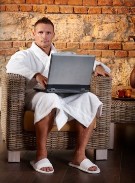 Portrait of relaxing man with laptop