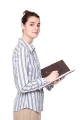 woman writing in notebook - side view