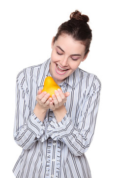 woman looking at pear hungrily