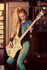 Fototapeta na wymiar Beautiful girl with a guitar