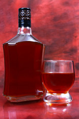 alcohol drink is in a bottle and glass