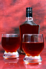 alcohol drink is in a bottle and glass