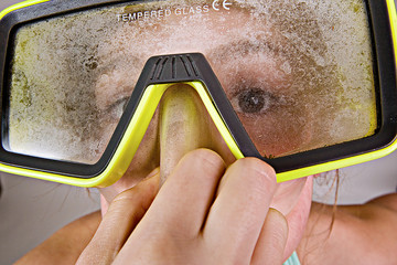 Scuba Diver Plugging her nose