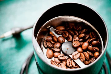  Electrical coffee-mill with roasted coffee beans © klevo