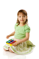 Girl playing on xylophone