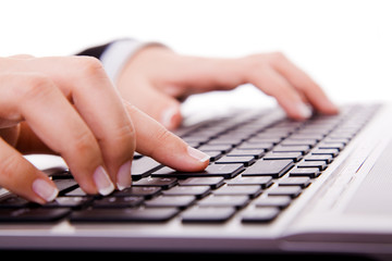 Close-up of secretary’s hand touching computer keys during work