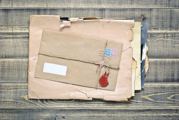 Old envelopes with papers a on wooden table