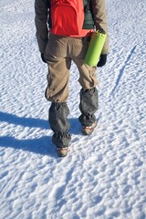 gaiters on trousers of trekking woman