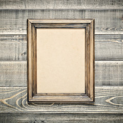 Old wooden frame with an empty cardboard