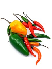 A selection of mixed chillies on a white background