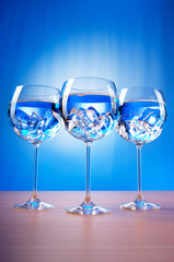 Water in the glass against gradient background