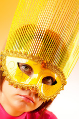 Attractive woman posing in the stylish mask