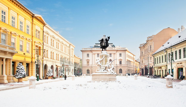 Nice square with statue at winter