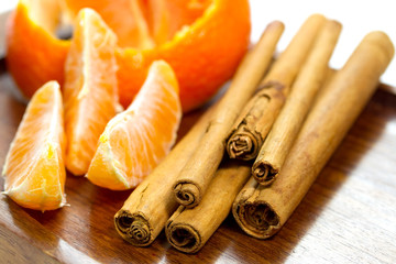 Orange with cinnamon sticks