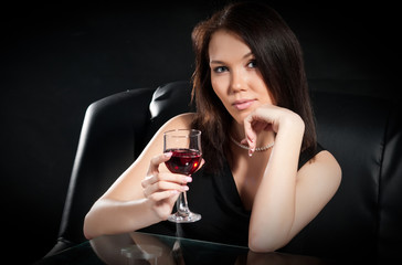 brunette with a glass of wine
