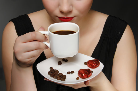 Woman Holding A Cup Of Black Coffee