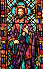 Stained Glass window of Jesus holding a scroll