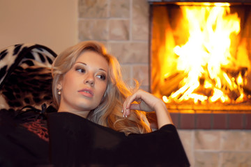 A woman near the fireplace