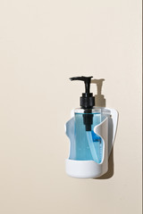 Waterless hand cleaner gel hanging on the wall