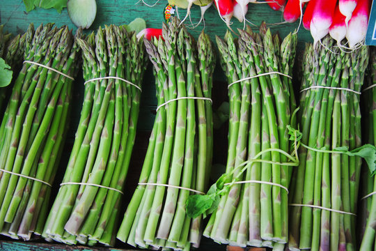 Green asparagus on mediterranean market stand