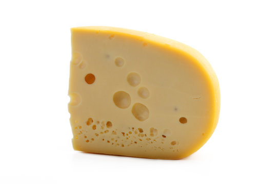 The cheese piece is isolated on a white background