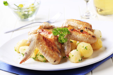 Roasted chicken wings and potatoes