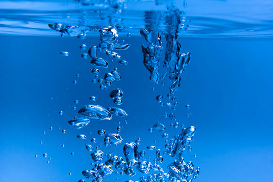 blue water and a splash of bubbles and drops