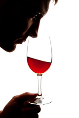 Silhouette of man degusting wine