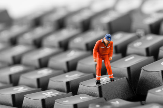 Worker looking into pit in keyboard