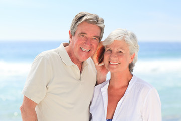 Retired couple listening to their shell