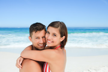 Fototapeta premium Beautiful couple at the beach