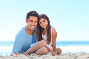 Father with his daughter at the beach