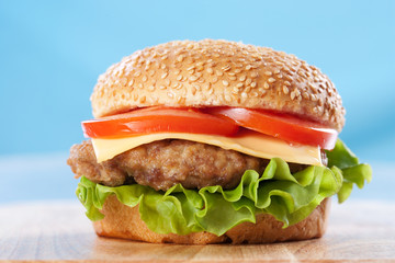 Cheeseburger with tomatoes and lettuce